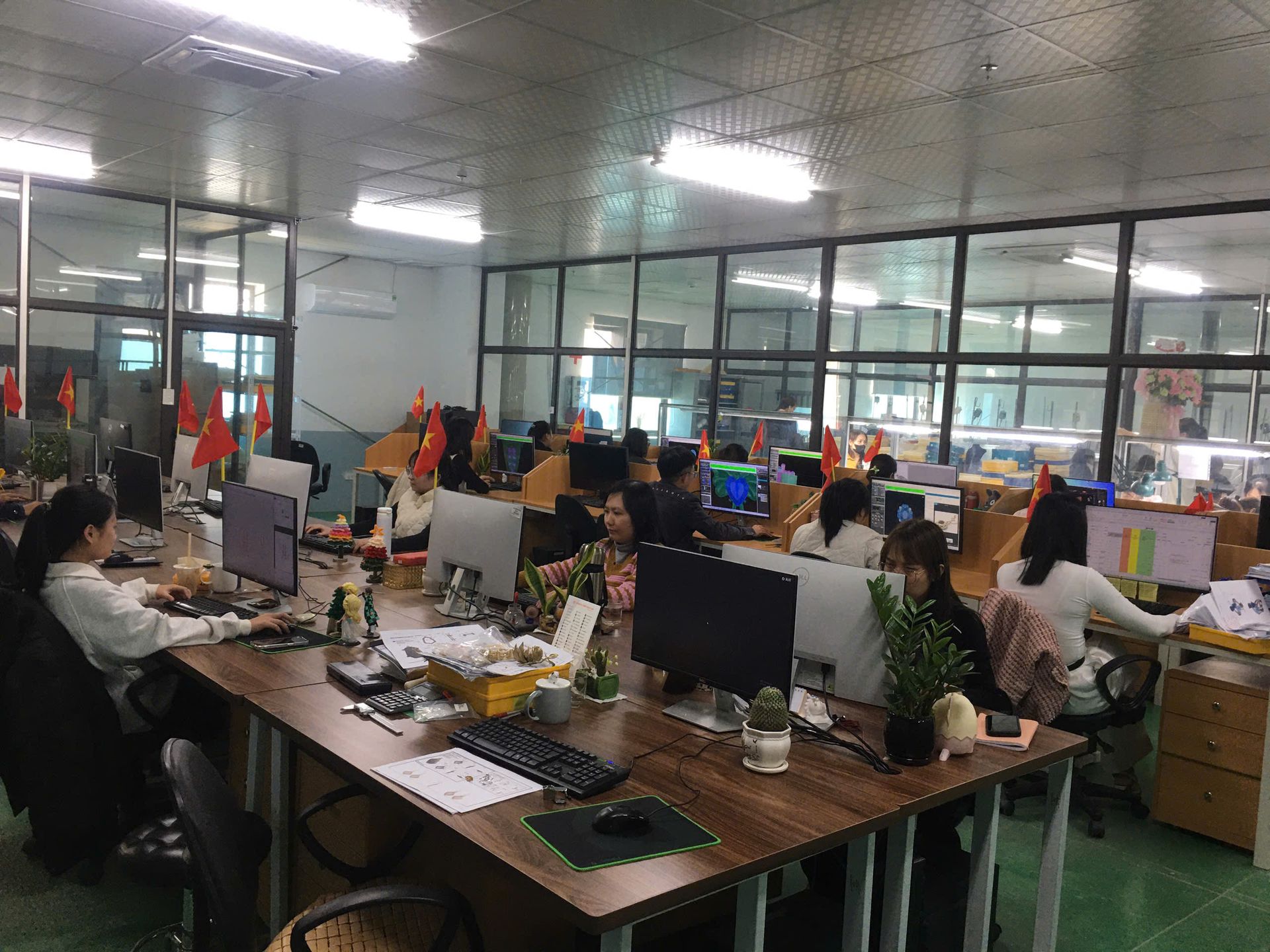 Jinyi Jewelry CAD design and engineering team working at computer workstations in our manufacturing facility.