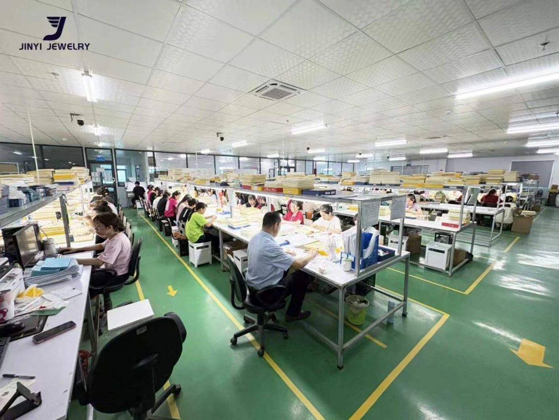 Wide view of an authorized JINYI Vietnam factory workshop with multiple staffed work areas and organized inspection trays