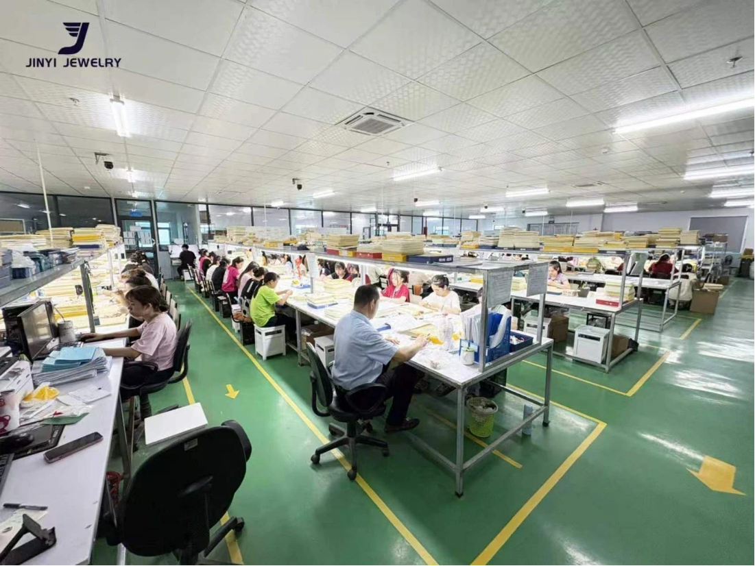 Authorized JINYI Vietnam factory photo showing a large organized workshop with staffed jewelry work areas